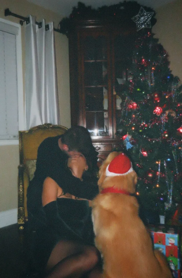 The Crippens and their dog beside the tree