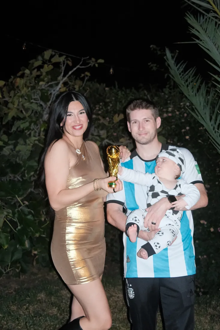 The Crippen family posing with a gold soccer trophy