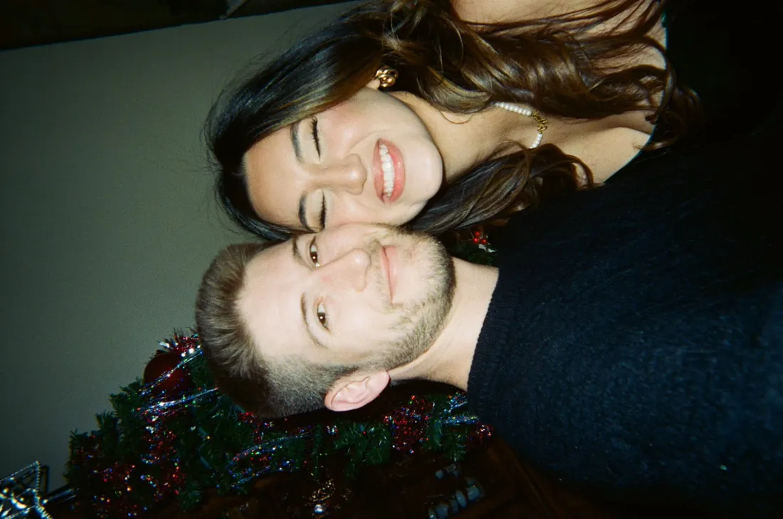 Cameron and Michelle together beside their Christmas tree