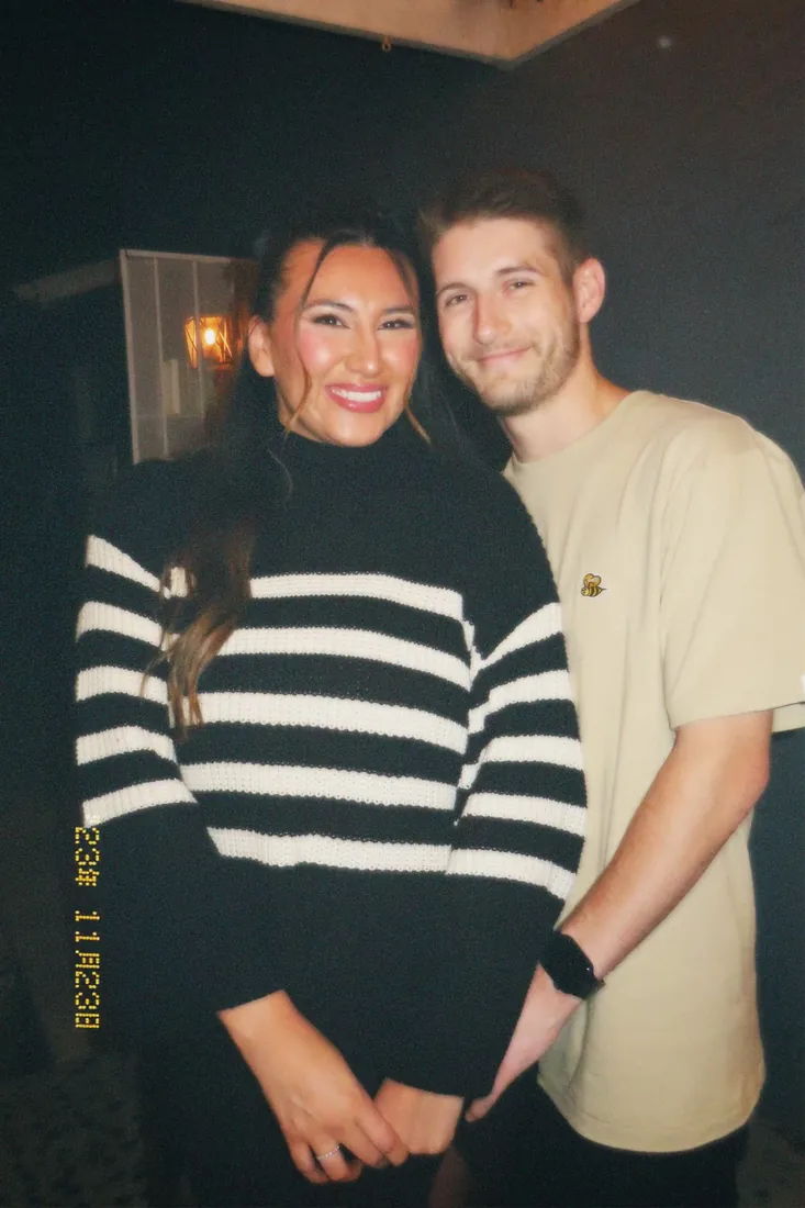 Cameron and Michelle posing together during the 2023 holiday season